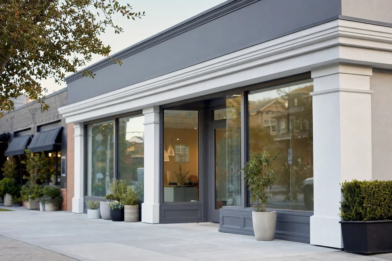 Tasteful storefront exterior in a clean neutral palette
