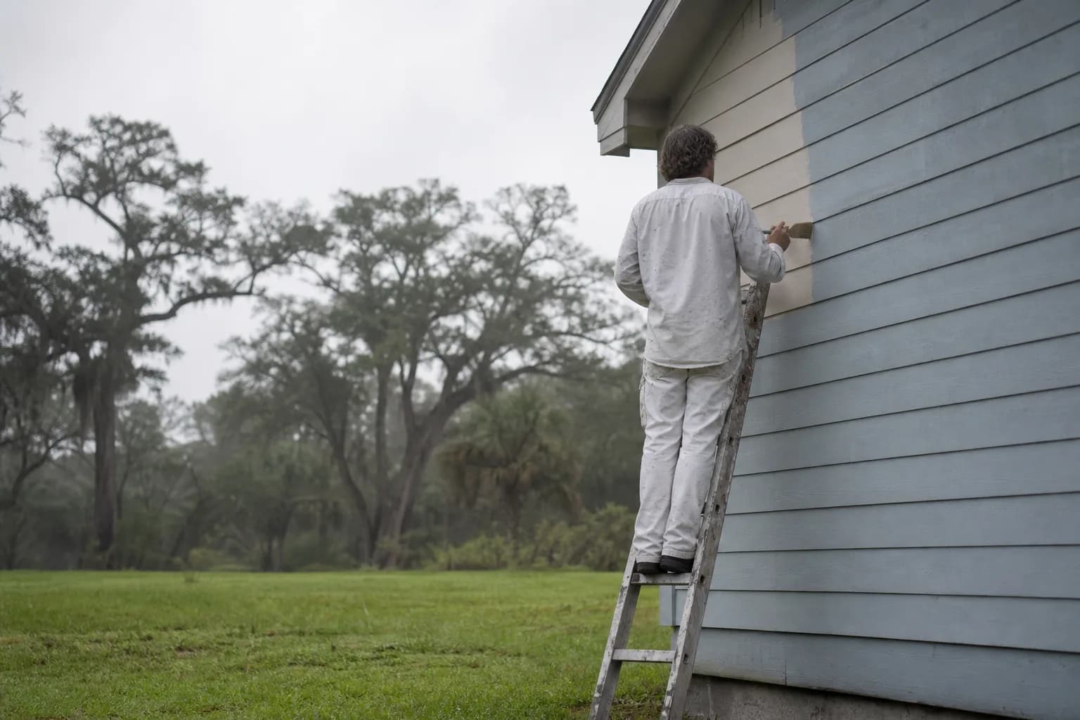 Painter timing a coat around the morning dew on a humid Mobile, AL day, working with humidity and dew point