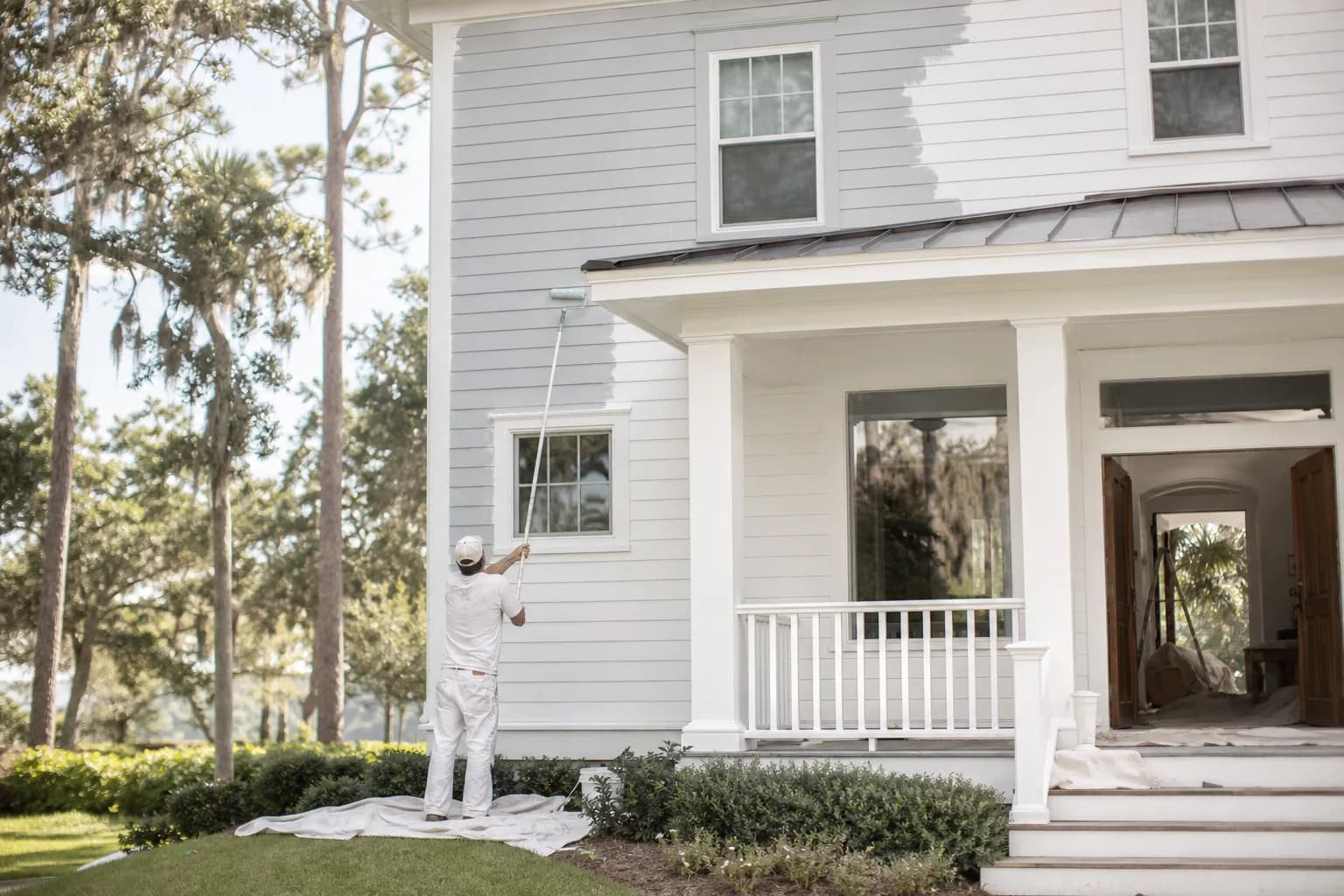 Whole-house painting project with interior and exterior work happening at once on a coastal Alabama home