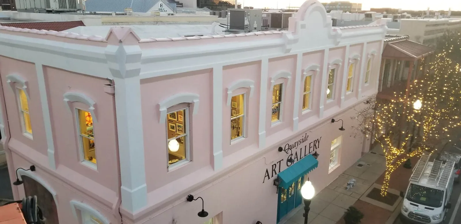 Quayside Art Gallery in Pensacola, FL — the historic Quayside Art Gallery facade at dusk after exterior painting, painted by Pro 1 Painters